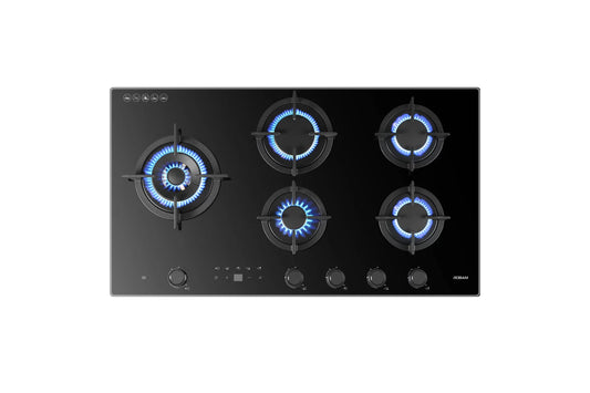Black gas stove with five burners on a white background