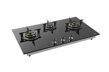 Black glass gas stove with three burners on a white background
