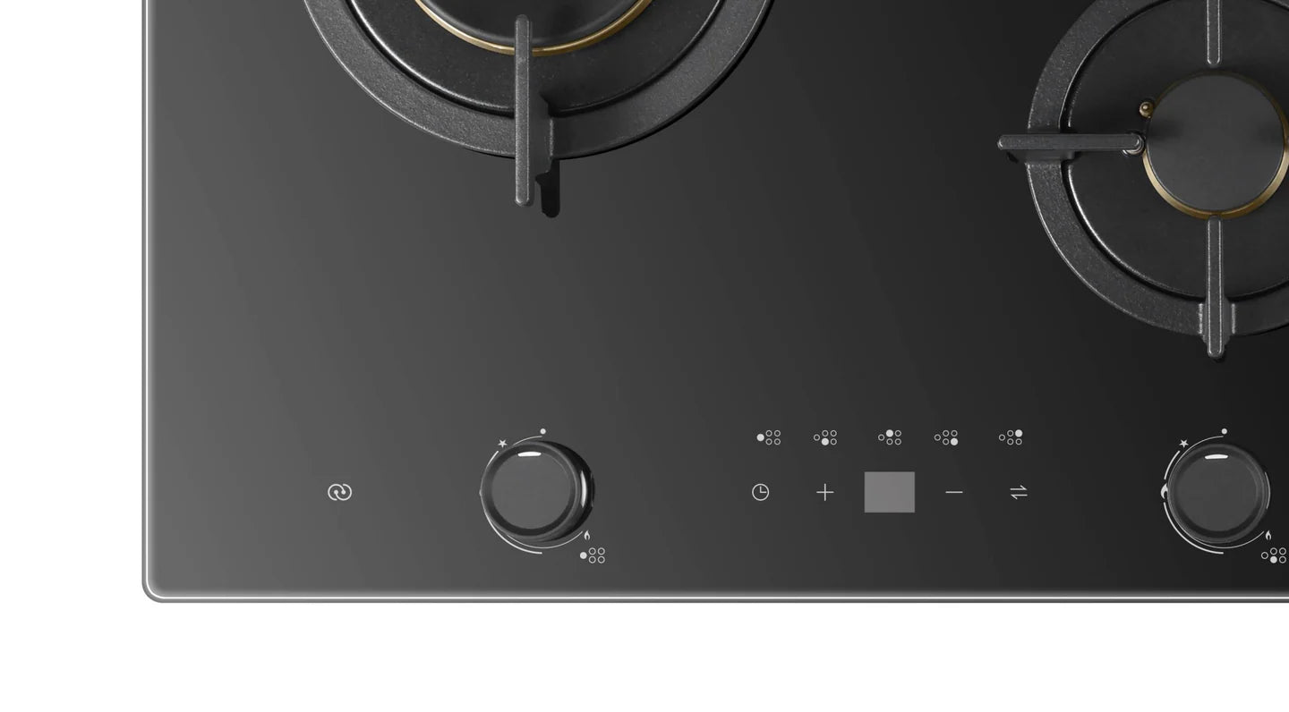 Close-up of a black glass cooktop for the main knobs on a white background